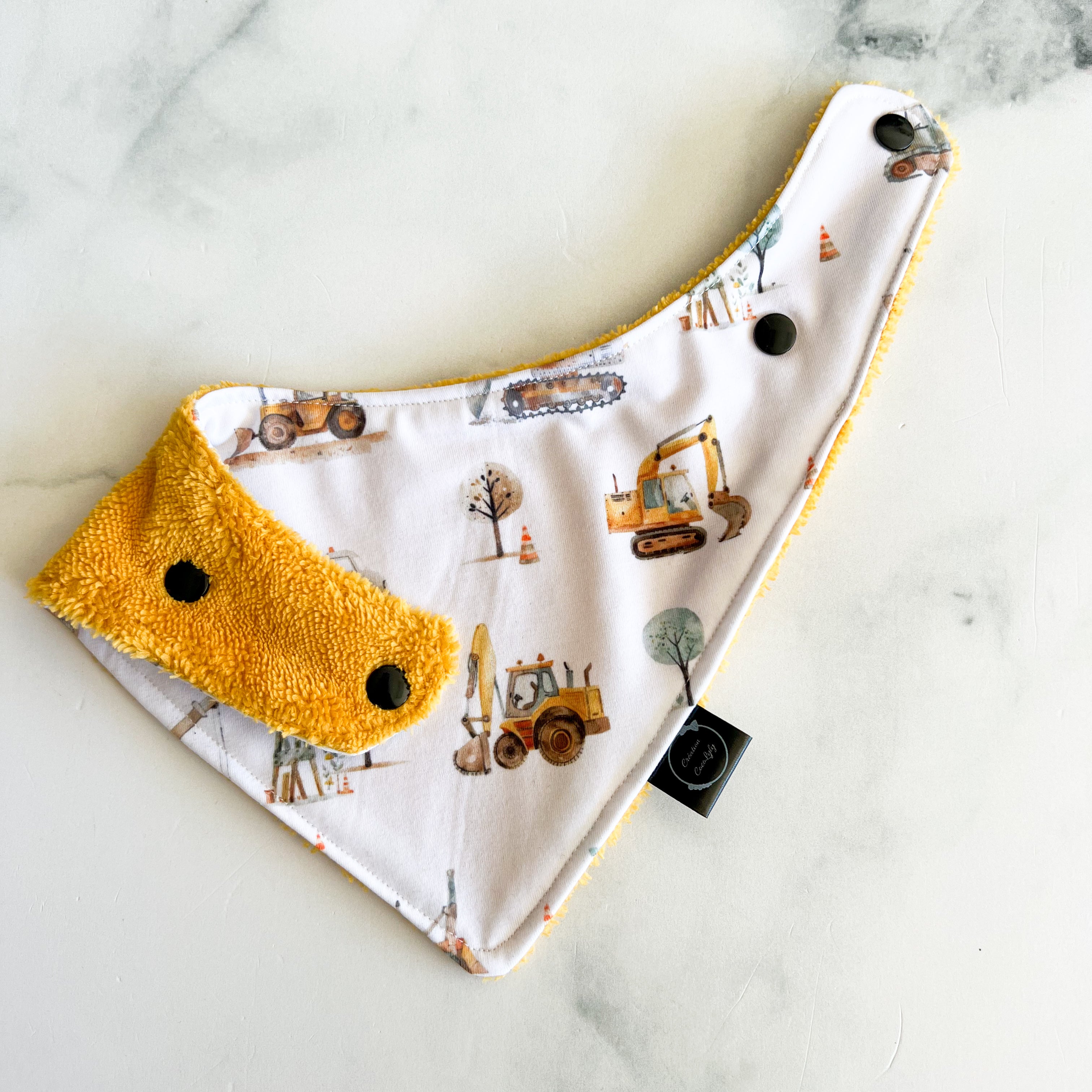 Bavoir les camions construction dos jaune