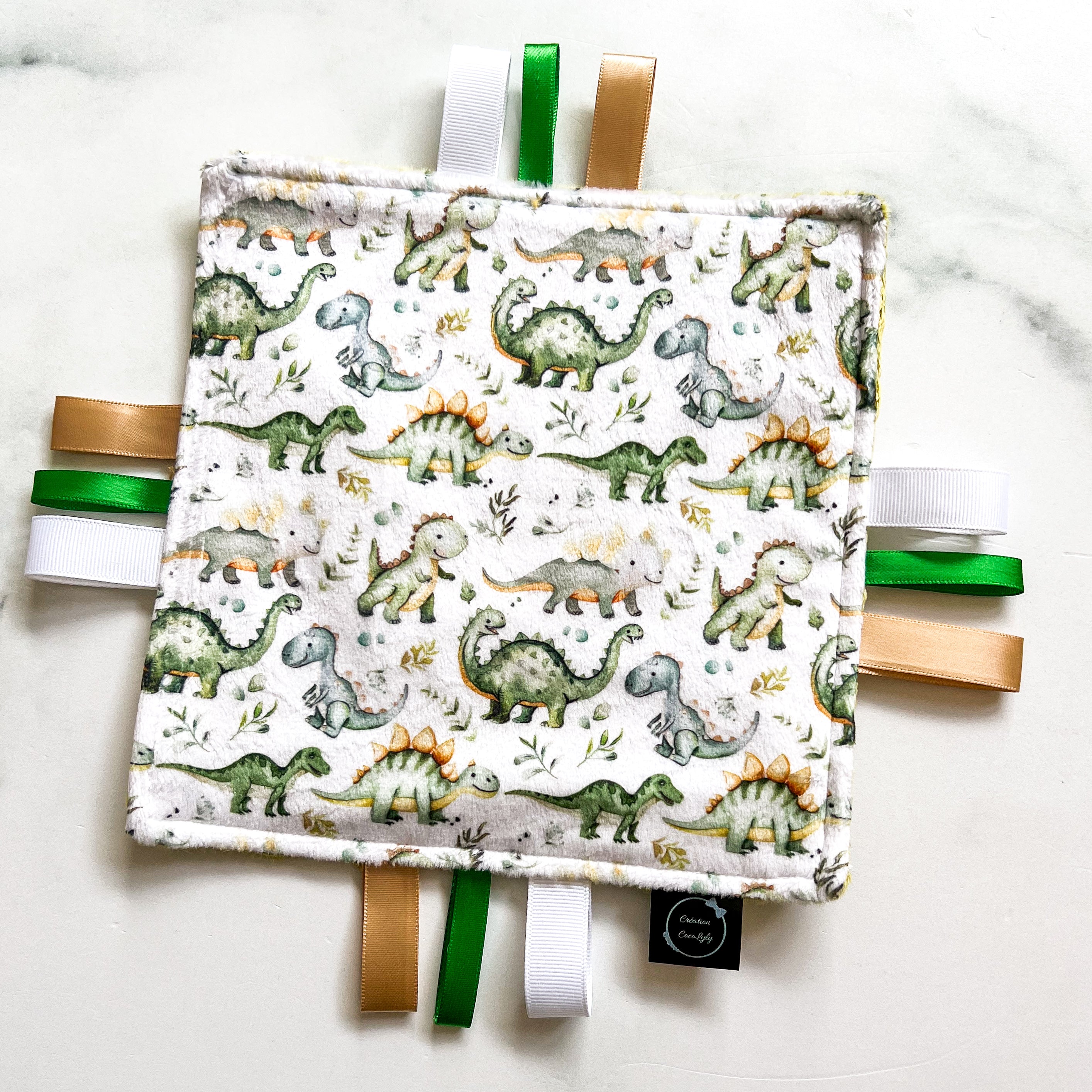 Doudou étiquettes craquante dino vert