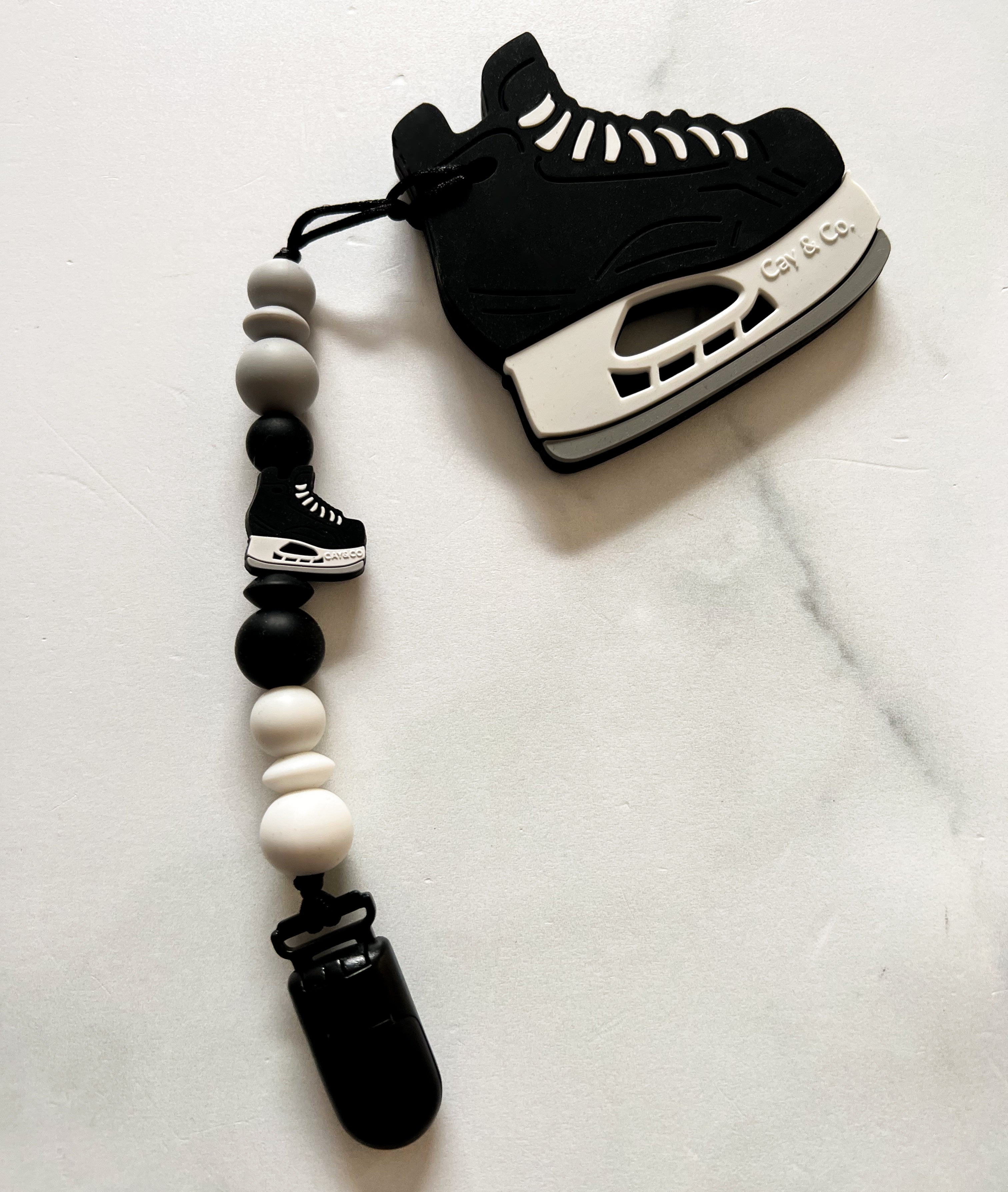 Duo attache suce et jouet patin hockey