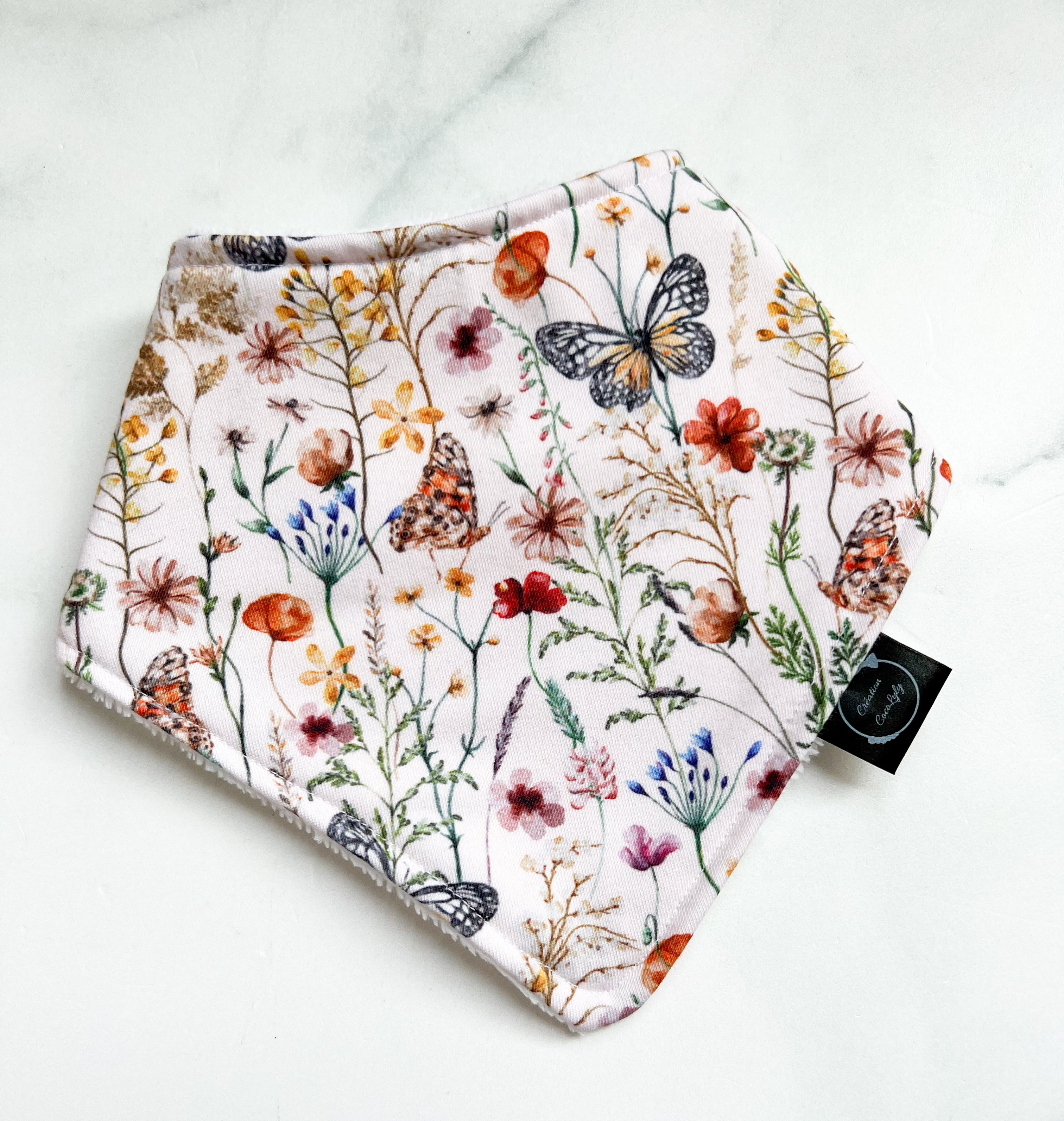 Bavoir les papillons et fleurs dos blanc