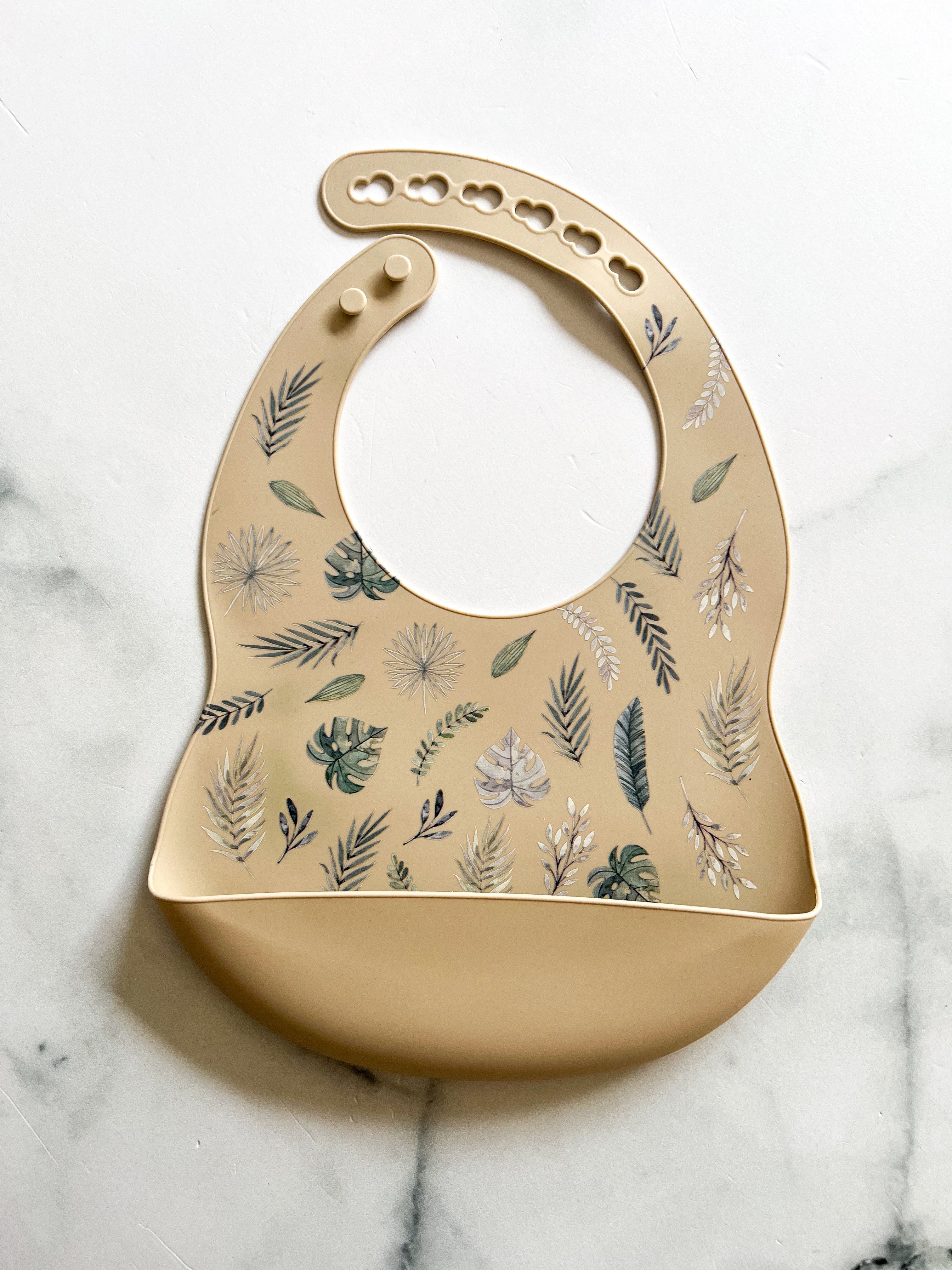 Bavette en silicone avec motifs feuilles