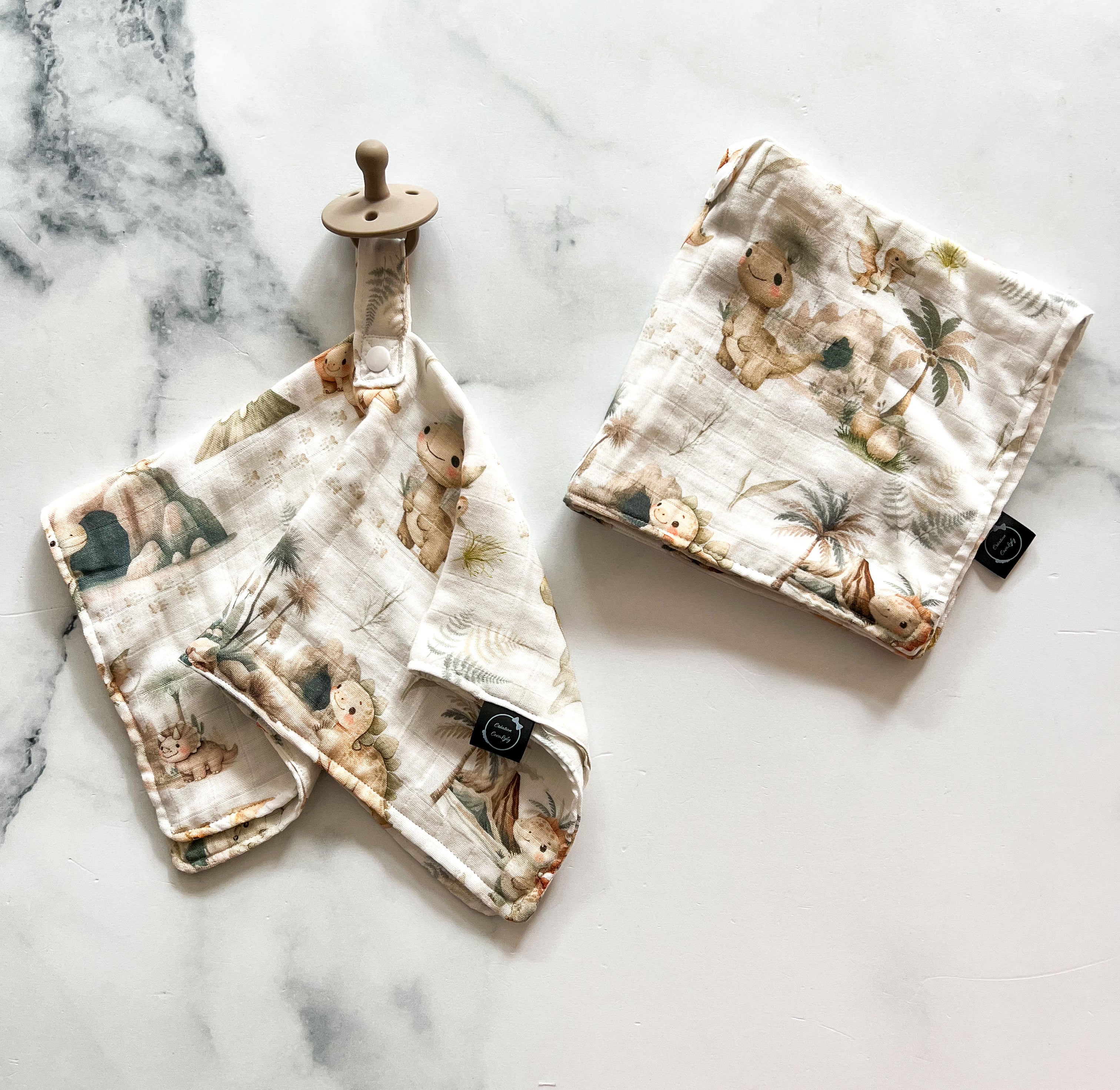 Attache-suce dinosaures en mousseline de bambou