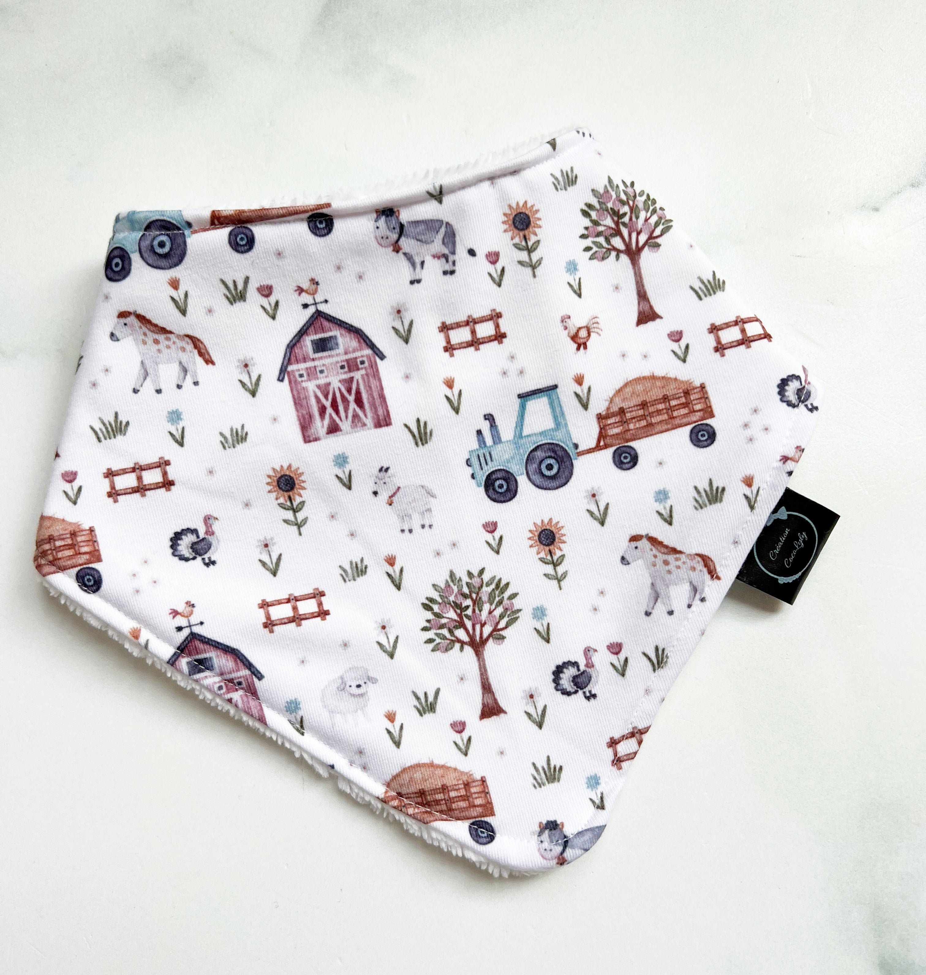 Bavoir la petite ferme dos bleu marin