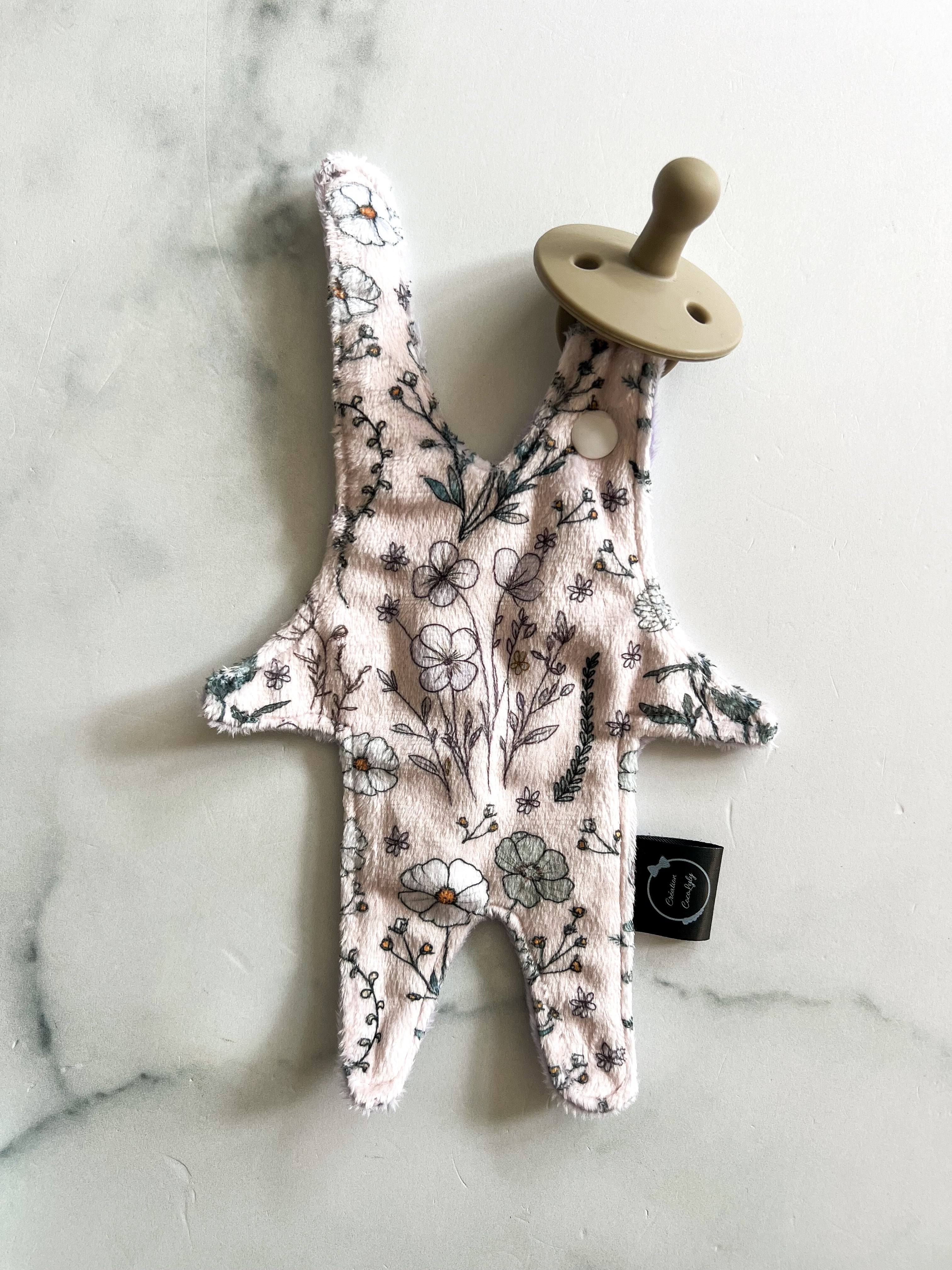 Attache suce petit bonhomme floral