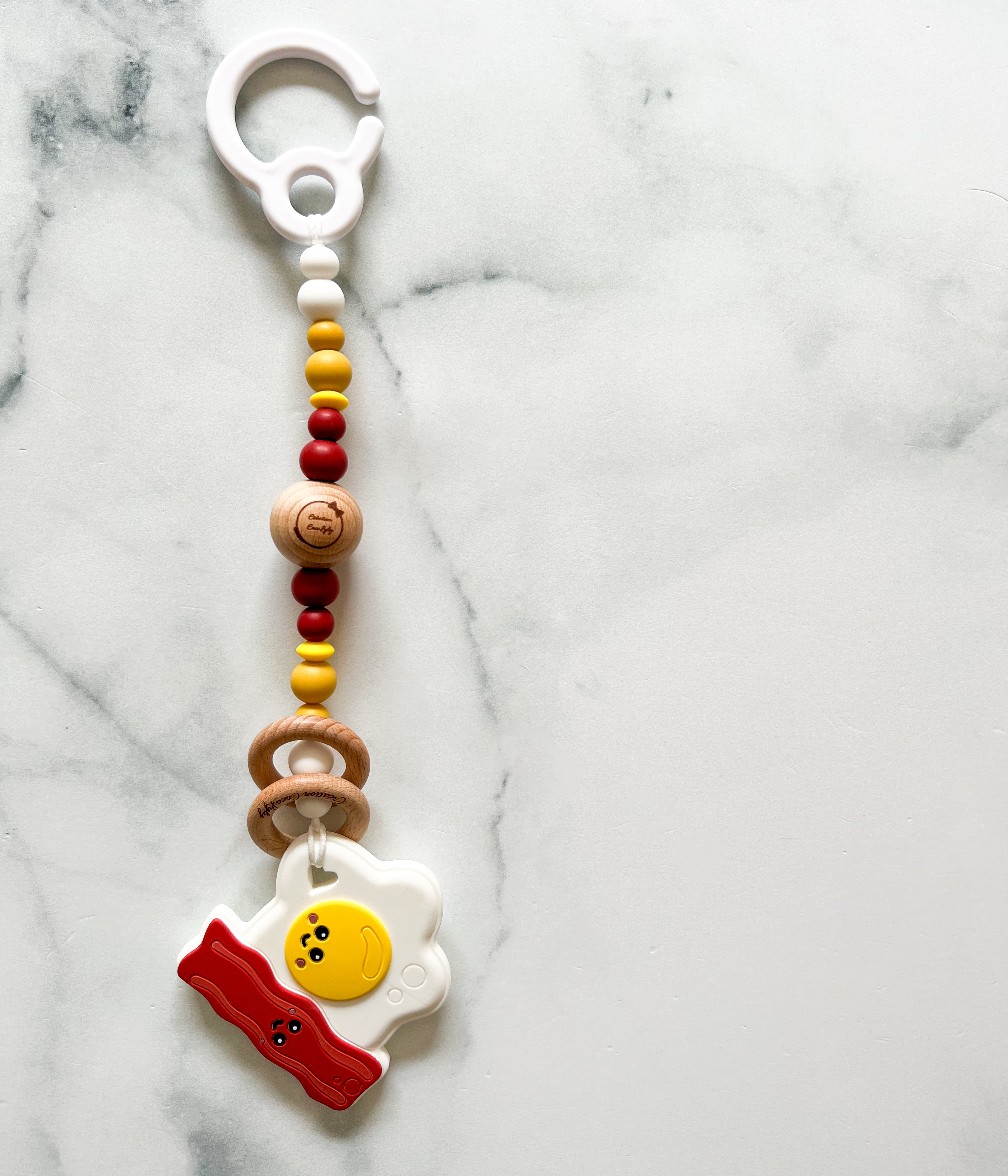 Attache jouet original œuf bacon