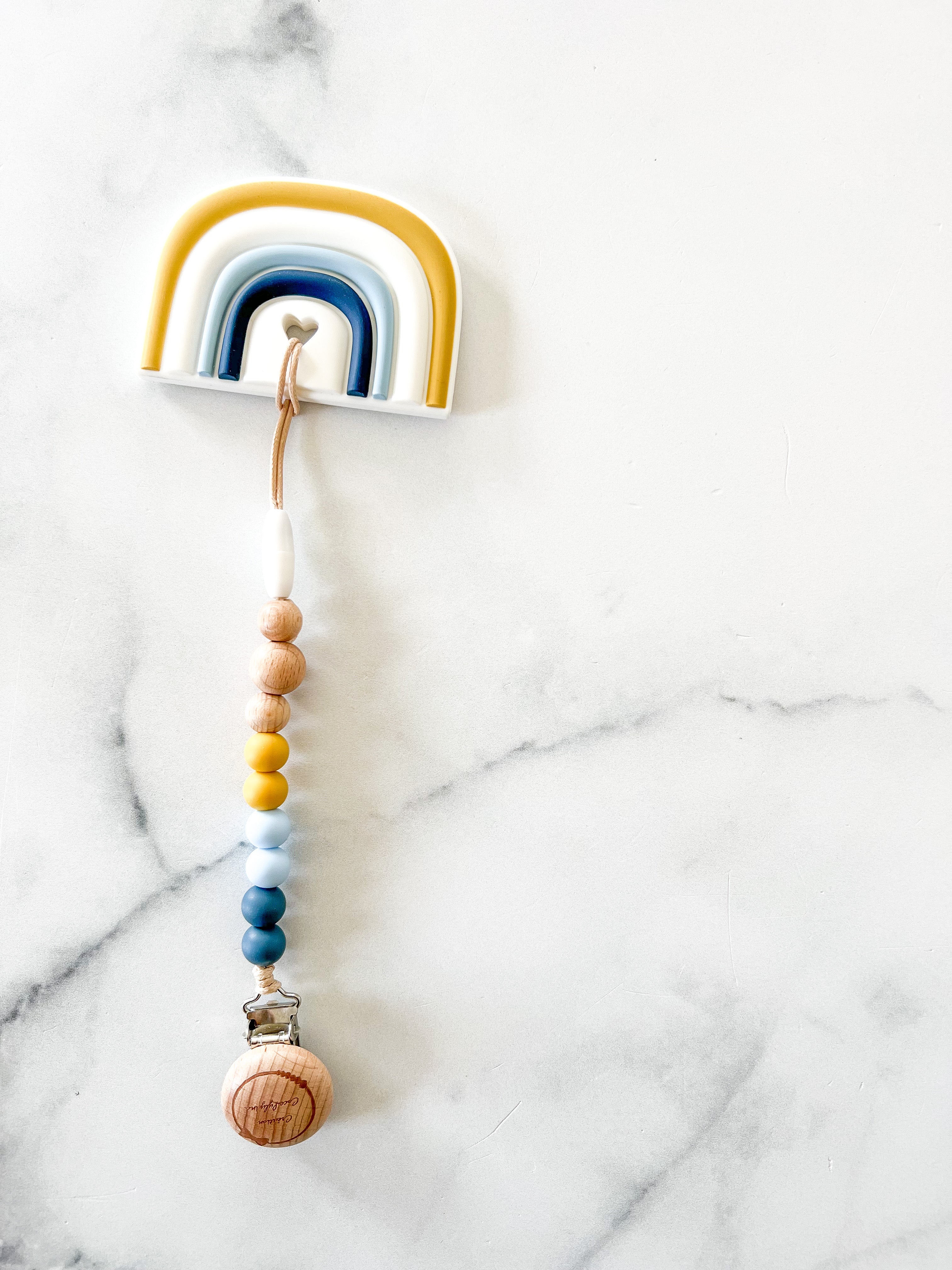 Duo attache suce et jouet arc en ciel