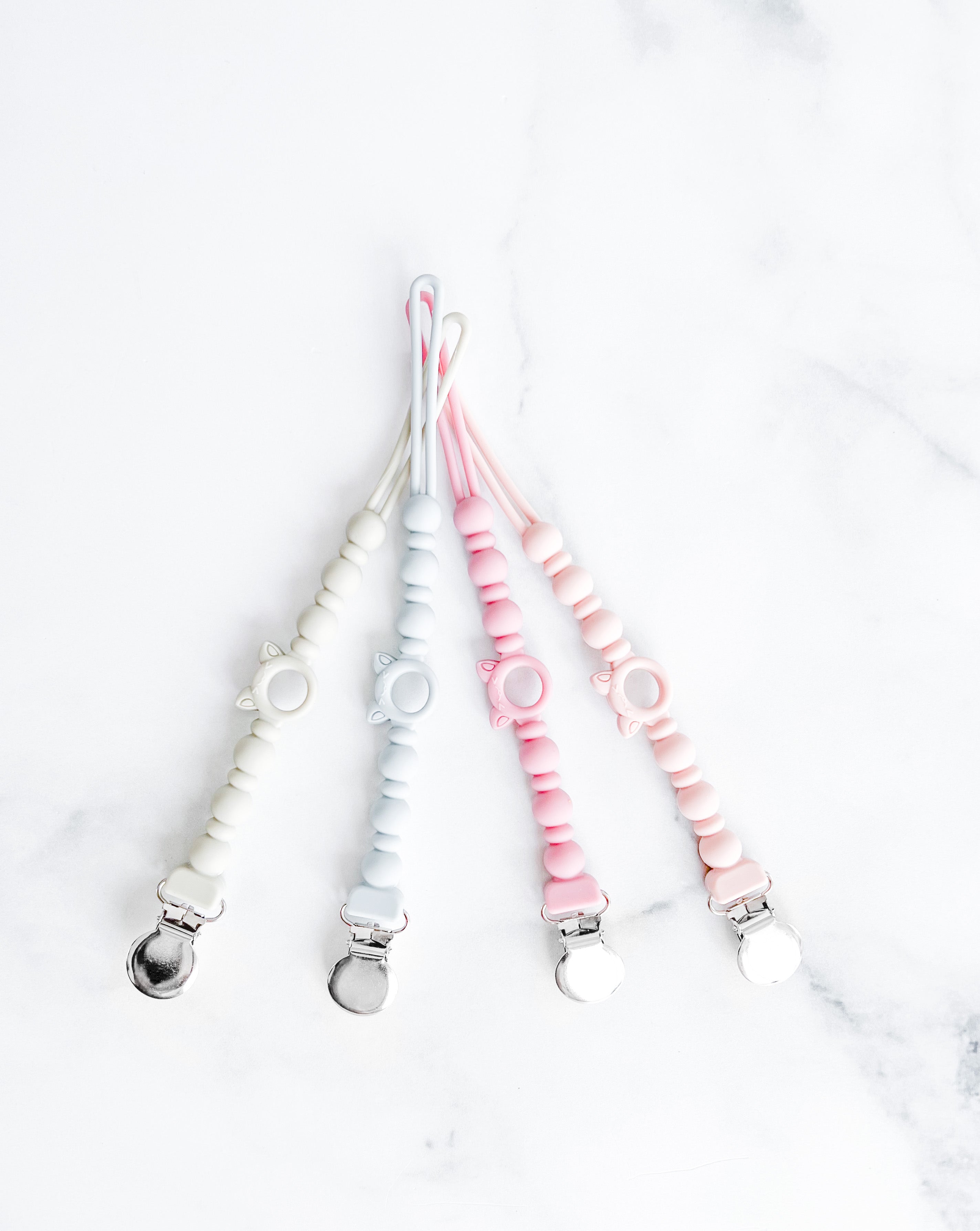 Attache suce tout en silicone style billes vieux rose