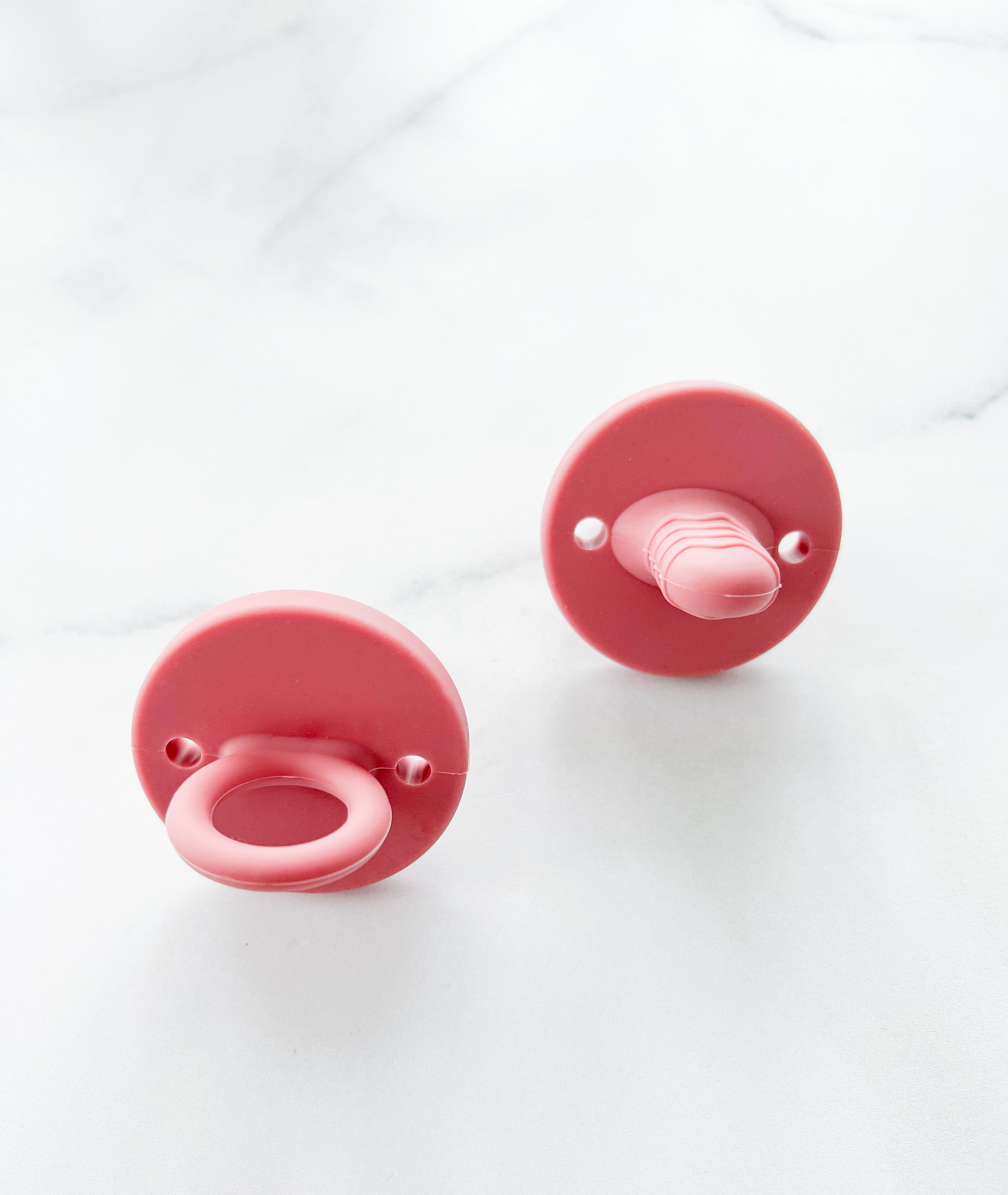 Suce de dentition rose profond