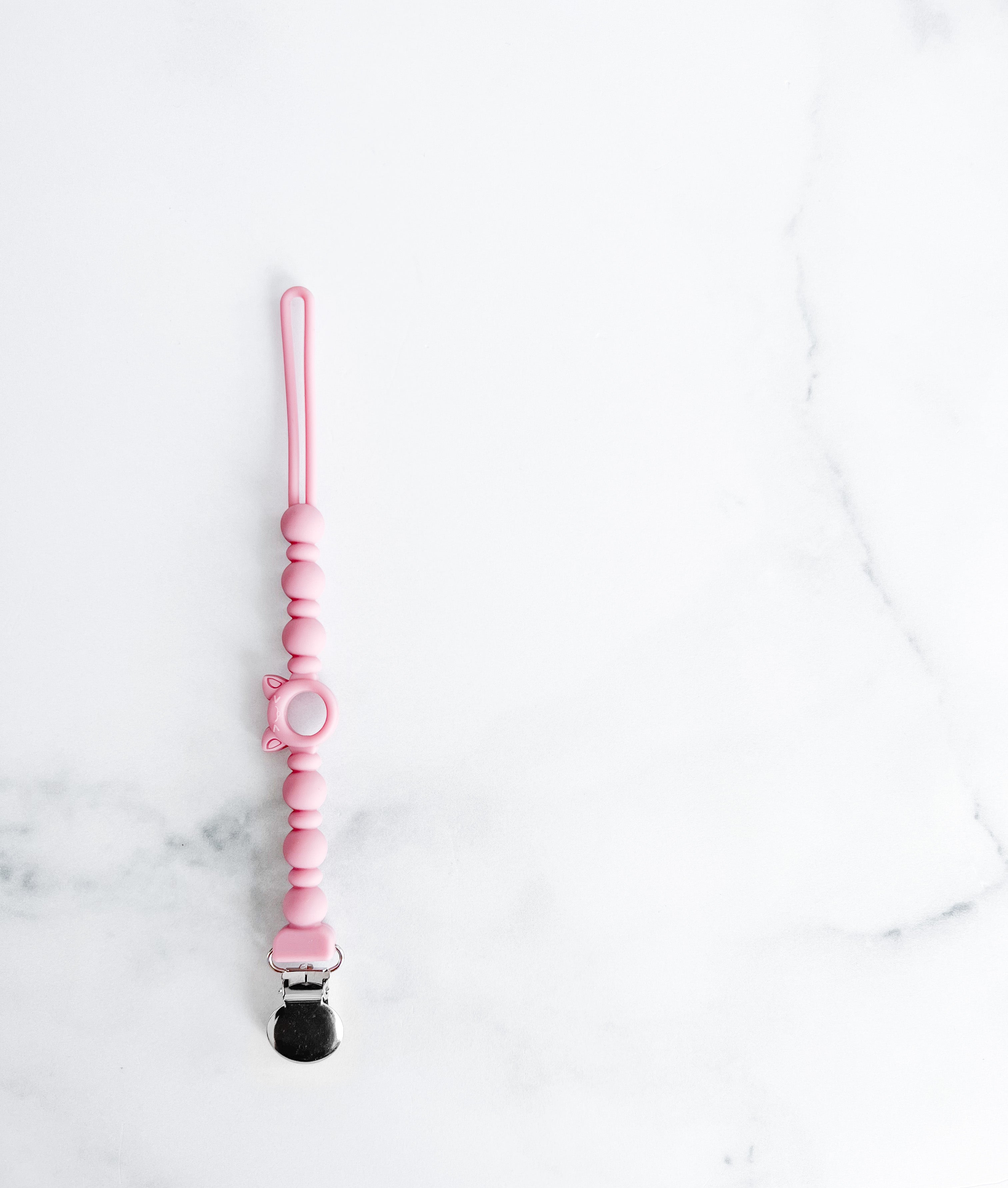 Attache suce tout en silicone style billes rose/mauve profond